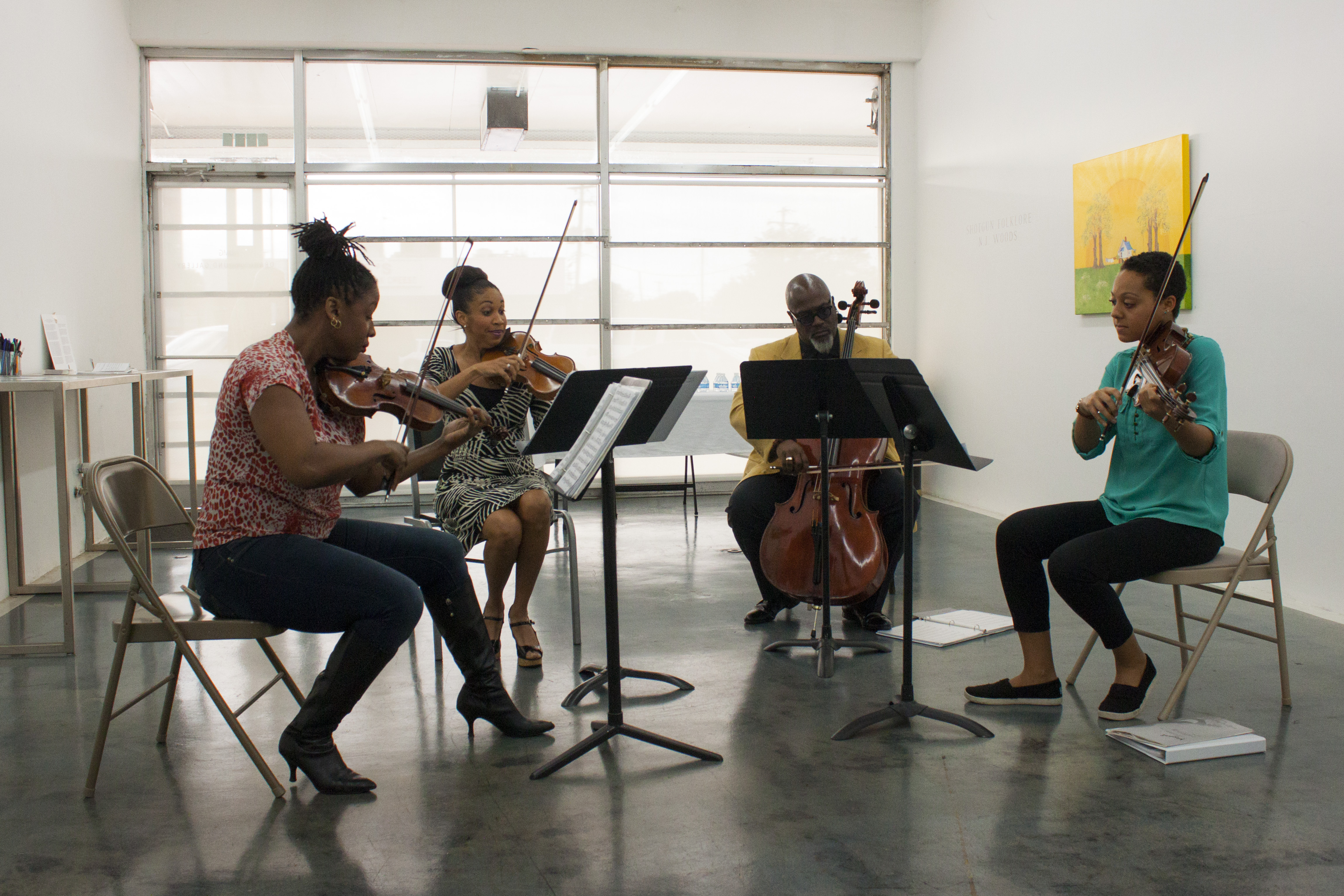 Members of the PRIZM Chamber Orchestra play as a string quartet during a meet and greet at Orange Mound Gallery on November 3. (From left to right: Chala Yancy, violin; Tami Hughes, violin; Derek Menchan, cello; and Dana Kelley, viola.