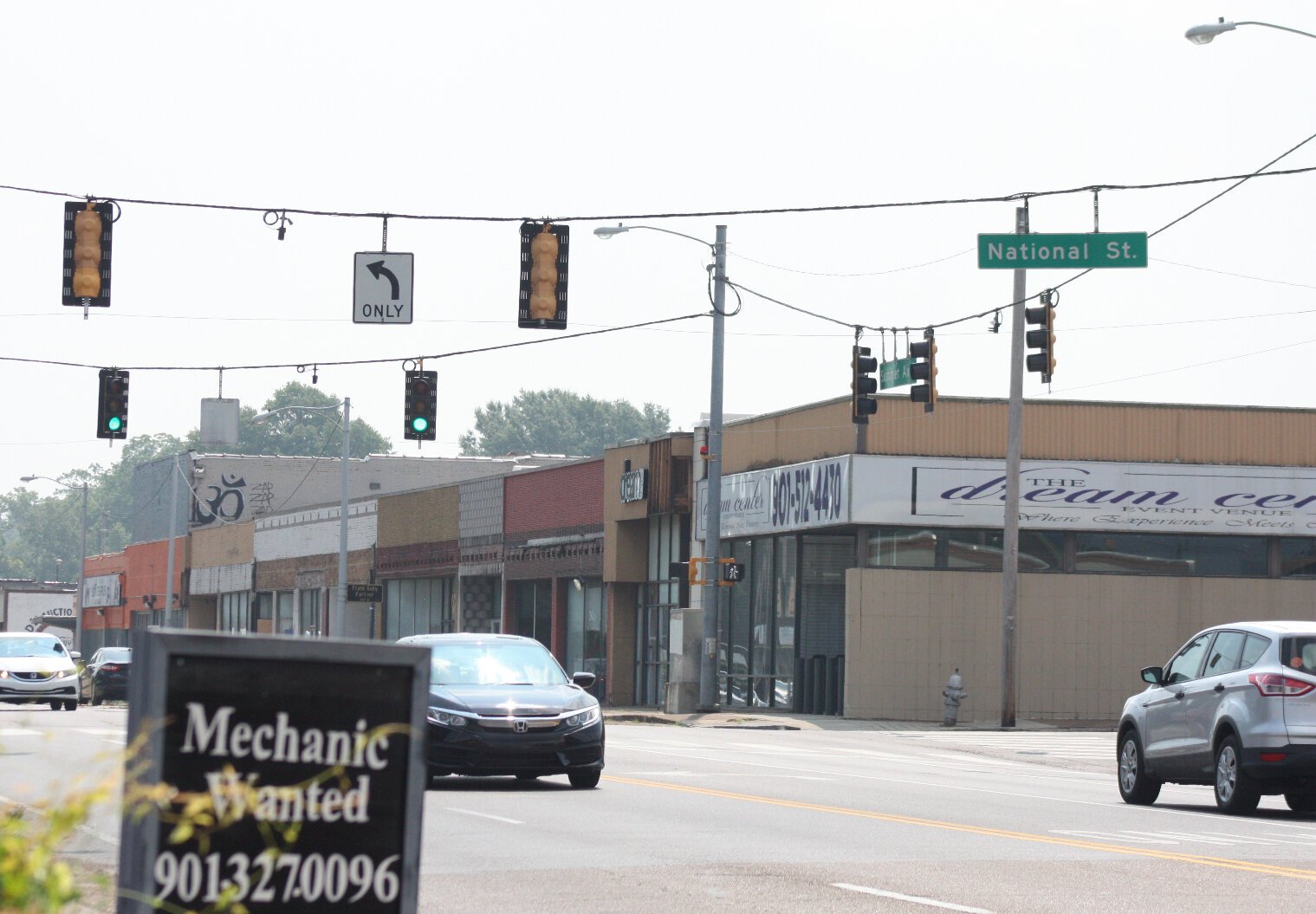 Drew Joyner and partners Octavius Nickson and Chris Hendrix of Nickson General Contractors purchased the 11-bay retail center at the southeast corner of Summer and National Street in May. They're now updating the exterior. (Cole Bradley)