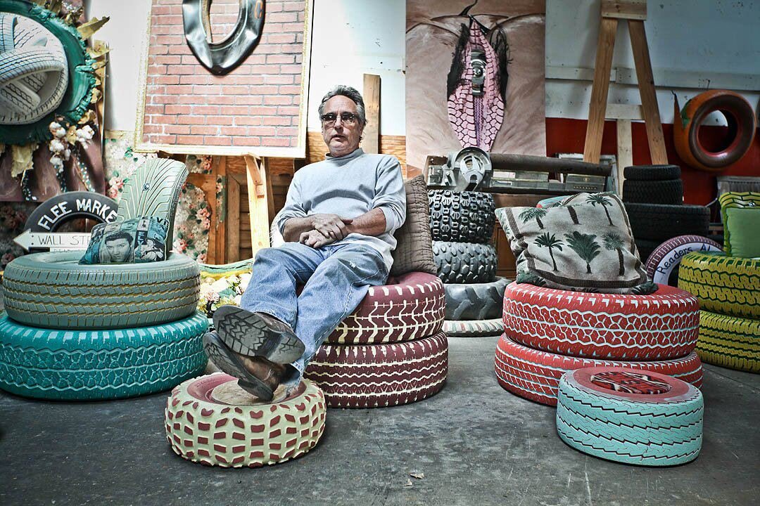 Memphis artist Tad Pierson reclines on one of his recycled tire creations. (submitted)