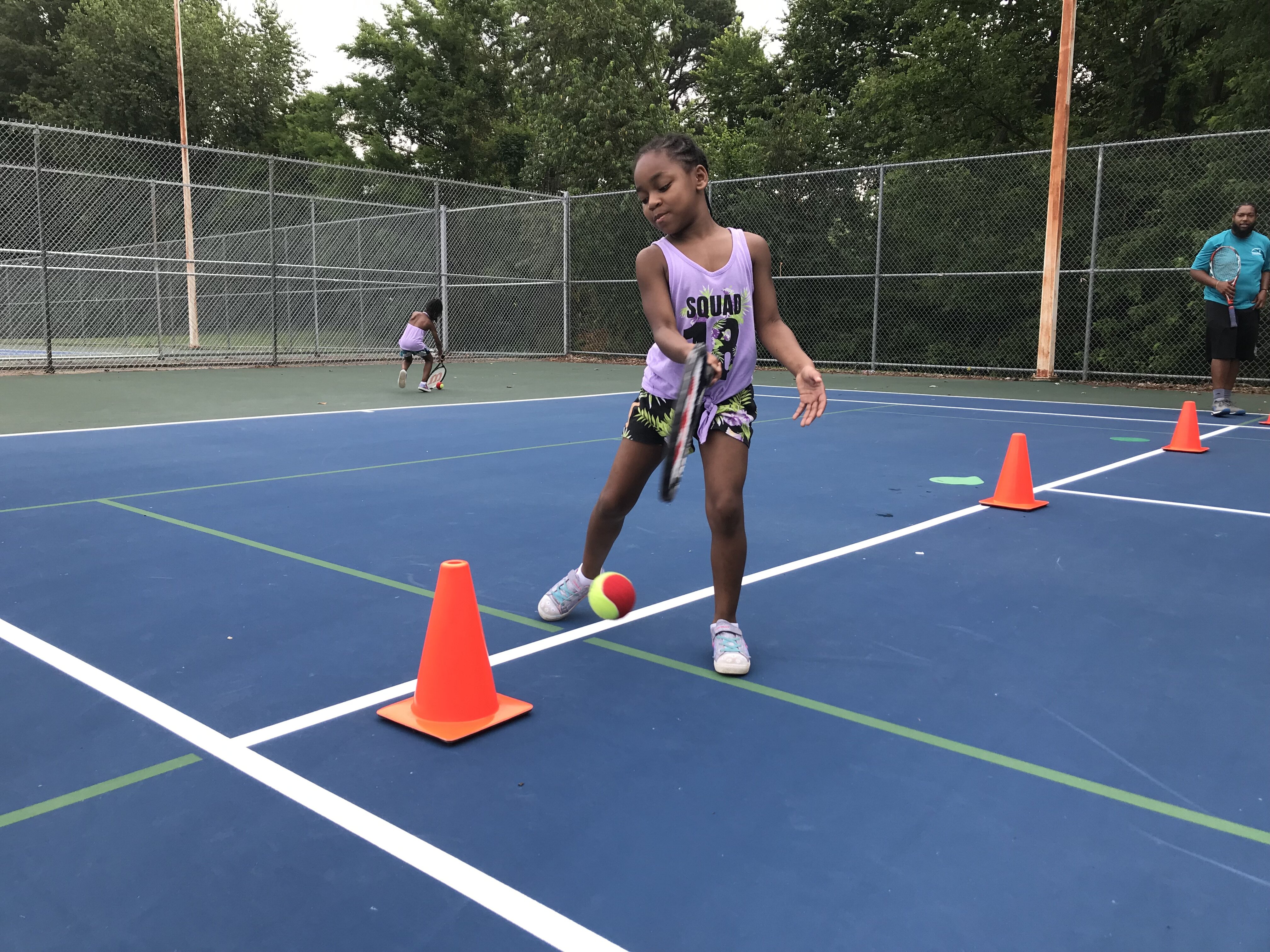 Aylah Sanders participates in a tennis skills drill during Tennis Memphis' Family Play Day, held on August 3 at the city’s municipal tennis centers. (Tennis Memphis)