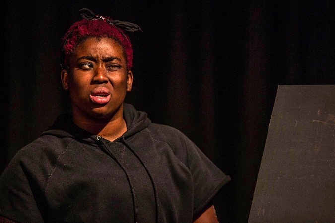 Brianna Hill portrays a boxing gym owner in "Collective Rage: A Play in Five Betties" performed at the University of Memphis Lab Theatre in August 2017.