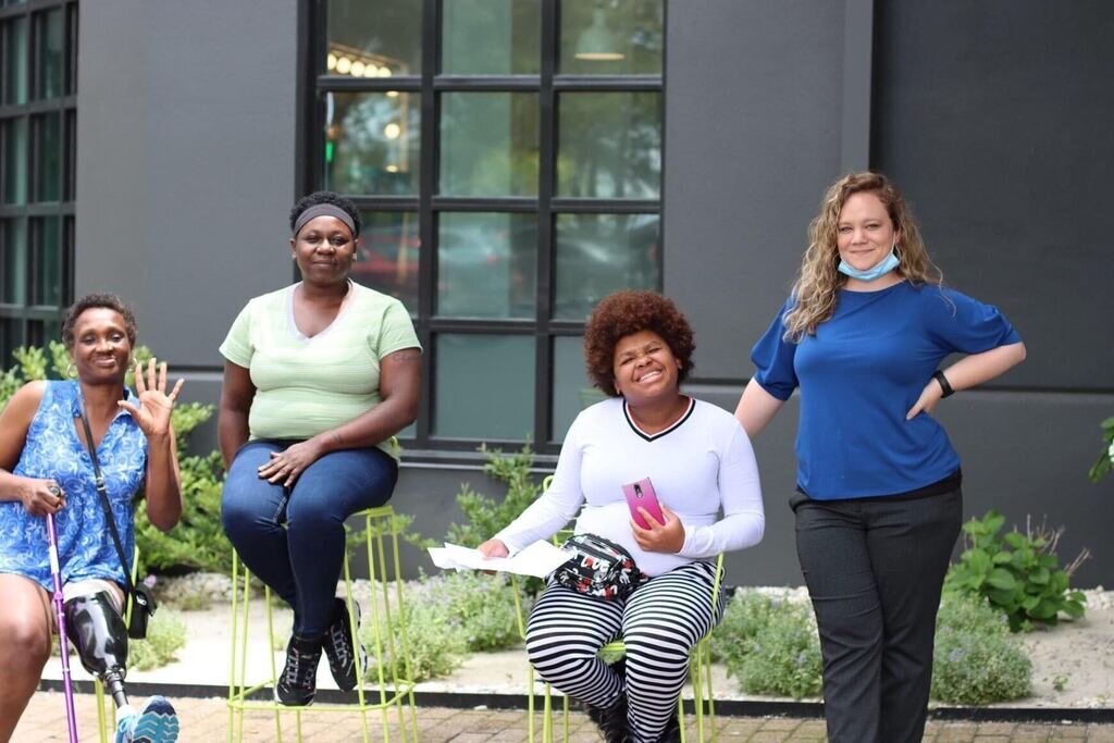 Guests of the Hub Hotel pose with Shelby Stonecipher (far right), Hub Hotel program manager. (Courtesy of Hospitality Hub)