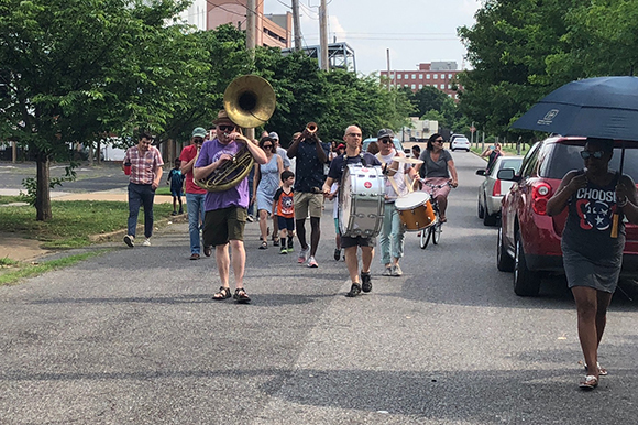 The Mighty Souls Brass Band led a second line parade through Uptown to kickoff the Treedom Memphis festivities.