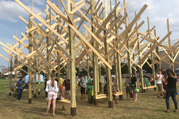 People from all walks of life mingle beneath the "branches" of Treedom Memphis.