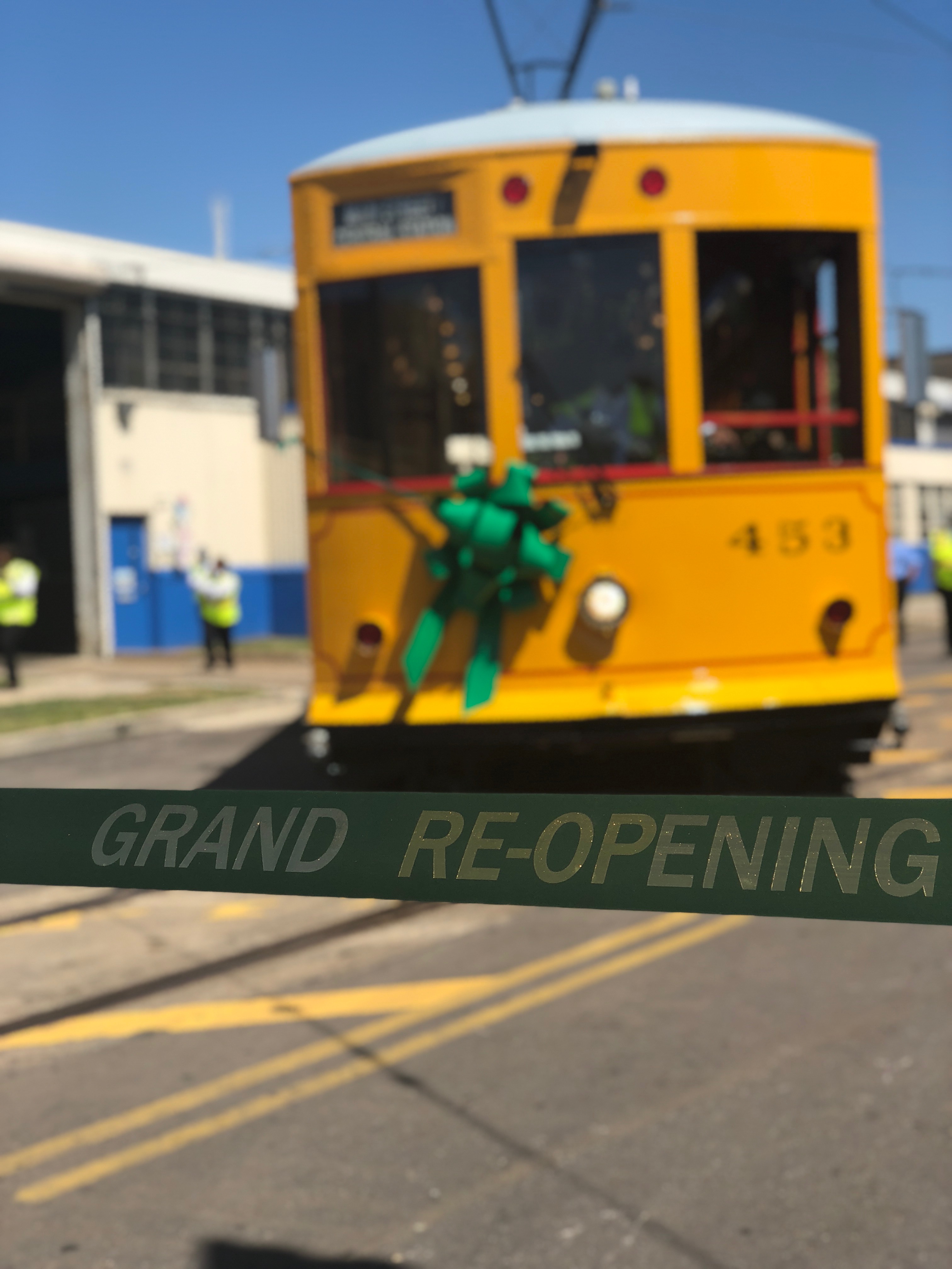 Applause and cheers erupted as the first of the trolleys was guided out of the garage and onto Main St. to await the ribbon cutting. (Shelda Edwards)