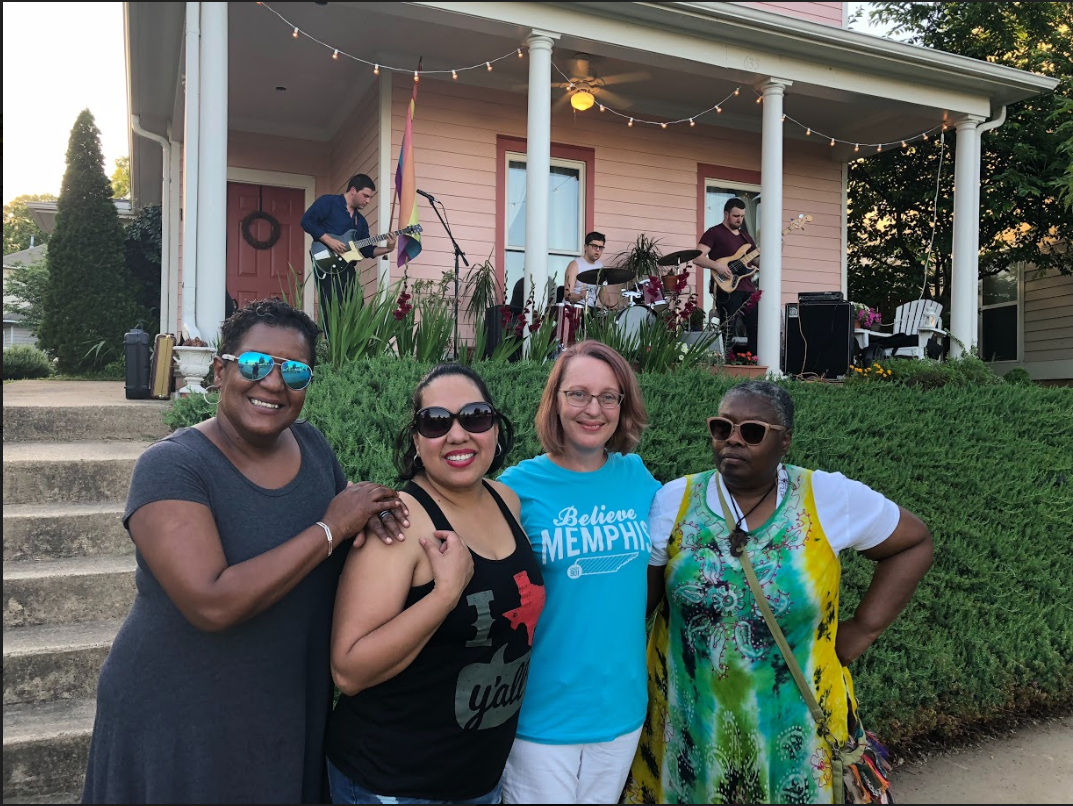 The leaders of the Uptown Community Association pose for a picture at the first porch series concert. L to R: Tanja Mitchell, Rebecca Garcia, Kaleigh Donnelly, and Njeri Fombi. (Cole Bradley)