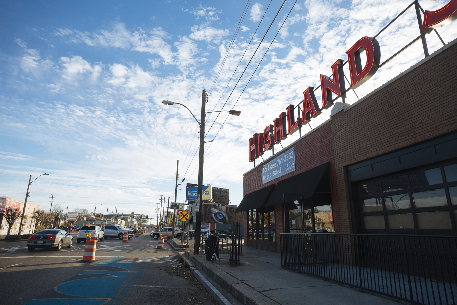 The Highland Strip features a bold sign to brand the area. Traffic cones mark recent street improvements. (Ziggy Mack)