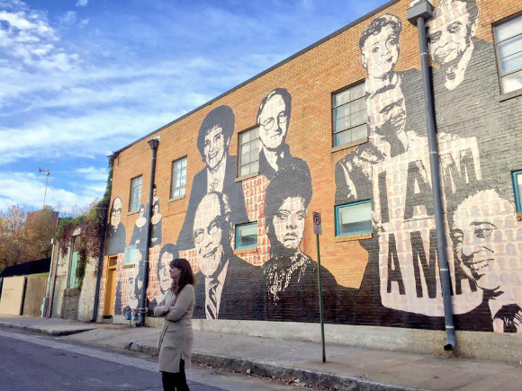 Lauren Kennedy in front of the Upstanders mural adjacent to the National Civil Rights Museum. The mural is a product of collaboration between the Urban Arts Commission and Facing History and Ourselves. (J. Dylan Sandifer)