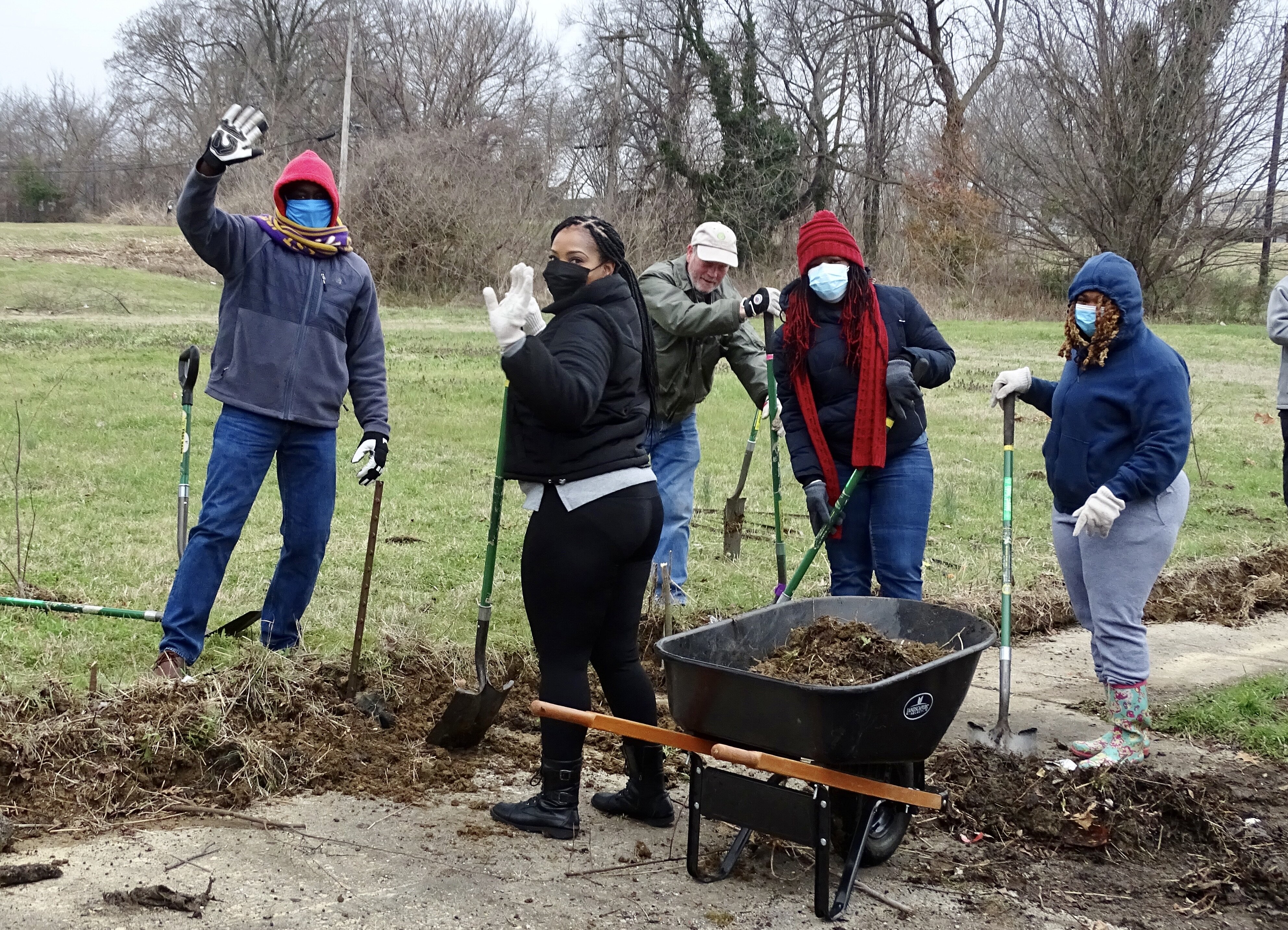 Volunteers with The Works CDC work together to clear a sidewalk along Jefferson Ave. (submitted)