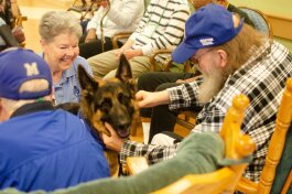 Handler San Chambers and therapy dog Batman are favorite regular visitors at Dorothy's Place. The day house is operated by  Alzheimer's and Dementia Services of Memphis, Inc. (Cat Evans)